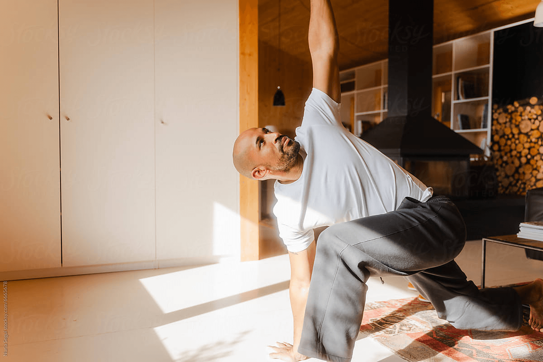 Man stretching at home